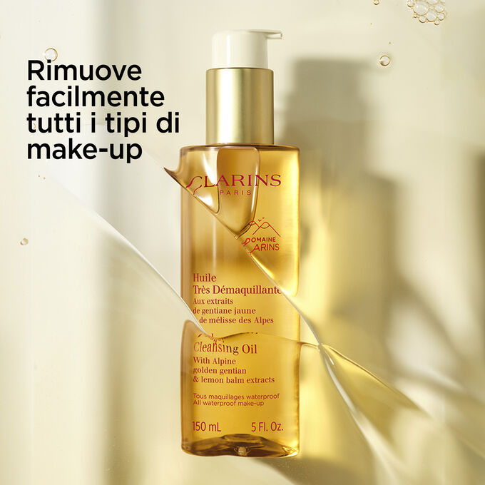 Packshot del flacone arancione dell’Olio Ultra Detergente con testo sulla sua efficacia su ogni tipo di make-up.